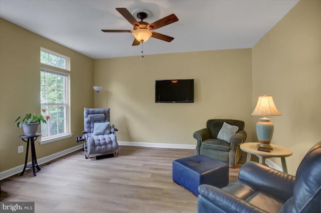 10526 Jasper Dr S, Greencastle, PA 17225 - living area featuring a ceiling fan, wood finished floors, and baseboards