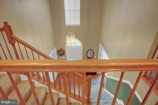 10526 Jasper Dr S, Greencastle, PA 17225 - stairs featuring a chandelier and a high ceiling