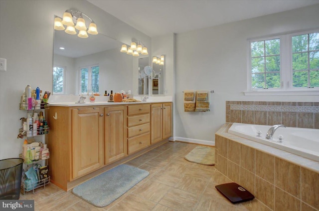 10526 Jasper Dr S, Greencastle, PA 17225 - full bathroom featuring double vanity, a bath, a chandelier, and baseboards
