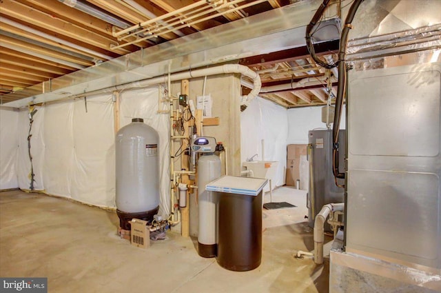 10526 Jasper Dr S, Greencastle, PA 17225 - unfinished below grade area featuring heating unit, a water softener, water heater, and a water pressure tank