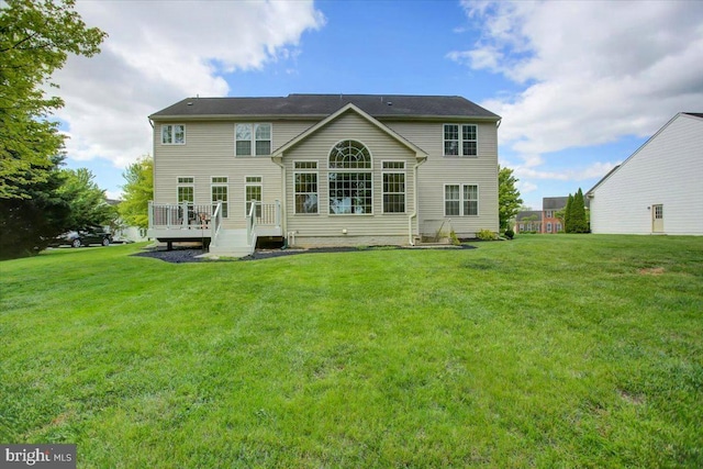 10526 Jasper Dr S, Greencastle, PA 17225 - back of house featuring a wooden deck and a lawn