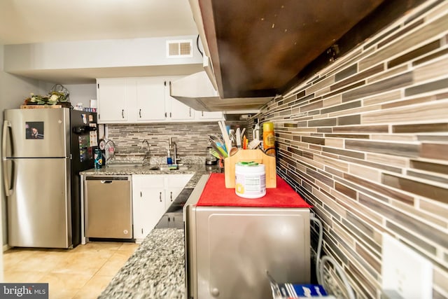 4548 Conwell Dr, Annandale, VA 22003 - kitchen with appliances with stainless steel finishes, backsplash, white cabinetry, and a sink