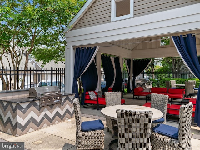 6888 Tasker Fls, Elkridge, MD 21075 - view of patio featuring exterior kitchen, a gazebo, and an outdoor living space