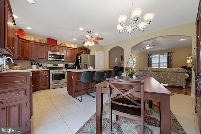 1009 Rosebud St, Reading, PA 19605 - kitchen featuring stainless steel appliances, ceiling fan, arched walkways, a sink, and recessed lighting