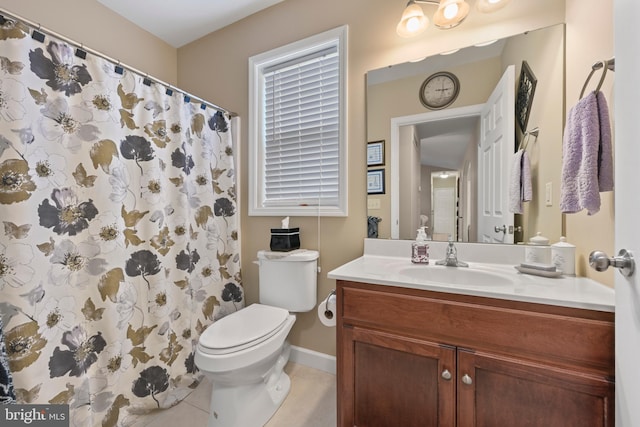 1009 Rosebud St, Reading, PA 19605 - full bathroom with vanity, toilet, tile patterned flooring, baseboards, and curtained shower