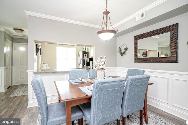 2305A Yarmouth Ln, Mount Laurel, NJ 08054 - dining room with a decorative wall, wood finished floors, crown molding, and a wainscoted wall