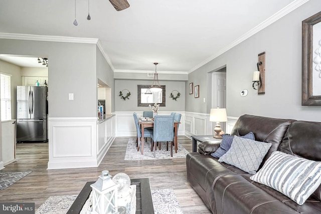 2305A Yarmouth Ln, Mount Laurel, NJ 08054 - living area with light wood-style floors, crown molding, and a wainscoted wall
