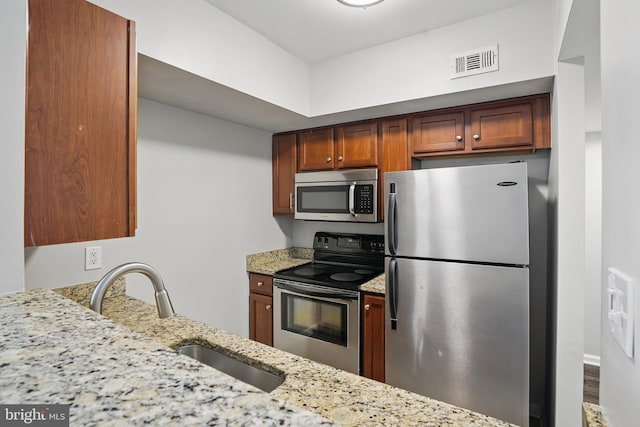 1001 Randolph St N Unit 523, Arlington, VA 22201 - kitchen featuring stainless steel appliances, a sink, and light stone counters