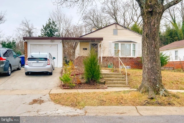 3312 Clay St, Silver Spring, MD 20902 - view of front of property featuring a garage, brick siding, and driveway
