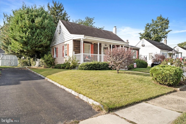 41 Collins Rd, Hamilton, NJ 08619 - view of front of property with a porch, a front yard, and a chimney