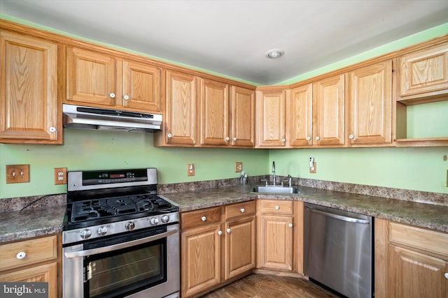 41 Collins Rd, Hamilton, NJ 08619 - kitchen featuring under cabinet range hood, stainless steel appliances, a sink, and dark countertops