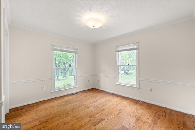 98 Magnificent Ln, Hedgesville, WV 25427 - empty room featuring light wood-style flooring, crown molding, baseboards, and a textured ceiling