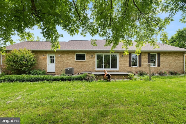 98 Magnificent Ln, Hedgesville, WV 25427 - back of house with brick siding, central AC, a lawn, and a shingled roof