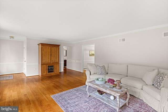 98 Magnificent Ln, Hedgesville, WV 25427 - living area with ornamental molding, light wood finished floors, and baseboards