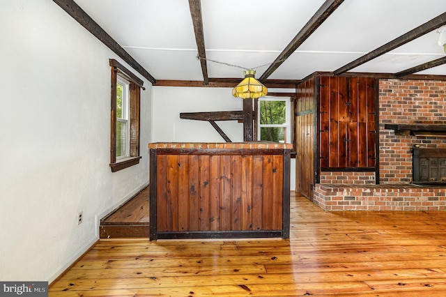 6908 S Roxbury Mill Rd, Spotsylvania, VA 22551 - kitchen with plenty of natural light, beam ceiling, hardwood / wood-style floors, and baseboards