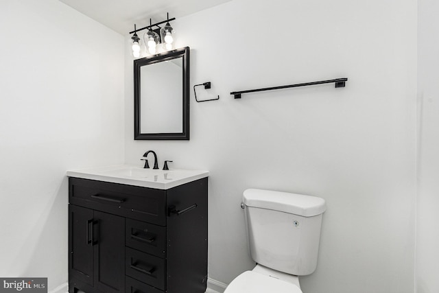 6908 S Roxbury Mill Rd, Spotsylvania, VA 22551 - bathroom featuring vanity, toilet, and baseboards