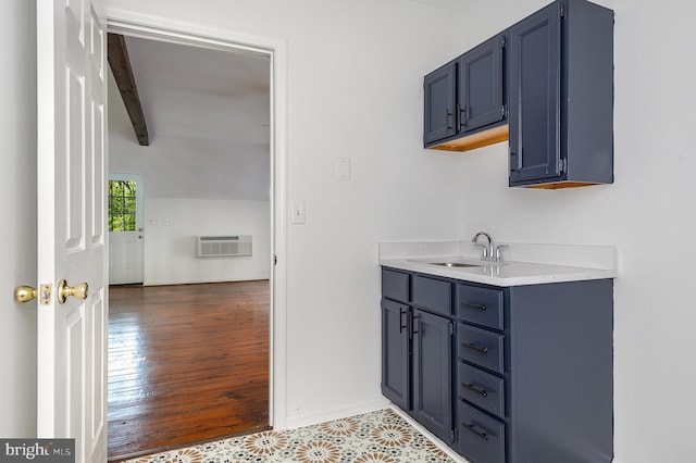 6908 S Roxbury Mill Rd, Spotsylvania, VA 22551 - bathroom featuring a wall unit AC, vanity, baseboards, and wood finished floors
