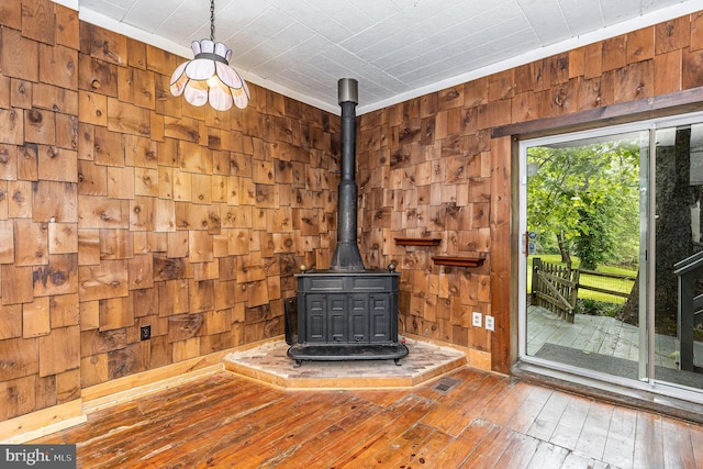 6908 S Roxbury Mill Rd, Spotsylvania, VA 22551 - detailed view of a wood stove, wood walls, and wood finished floors