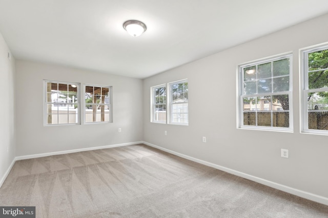 1205 Mirga Cir, Baltimore, MD 21207 - spare room featuring carpet floors, plenty of natural light, and baseboards