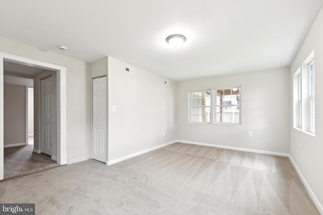 1205 Mirga Cir, Baltimore, MD 21207 - unfurnished room featuring carpet flooring, healthy amount of natural light, baseboards, and a smoke detector