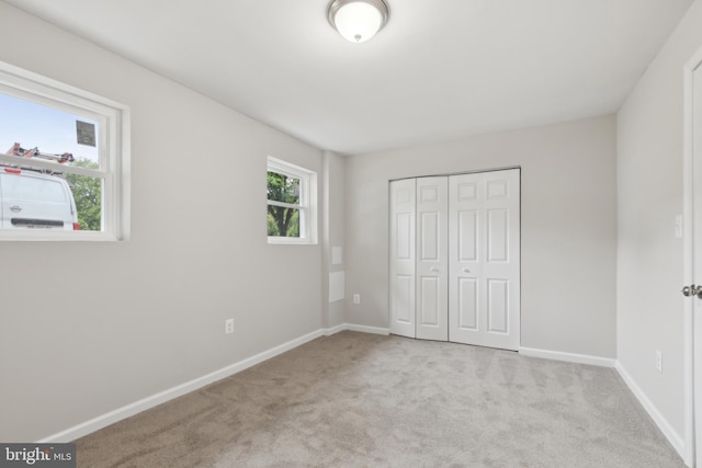 1205 Mirga Cir, Baltimore, MD 21207 - unfurnished bedroom featuring carpet, baseboards, and a closet