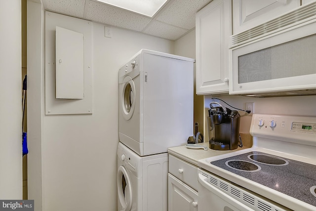 506 Brandywine House Rd Unit 506S, Bethany Beach, DE 19930 - washroom featuring stacked washing machine and dryer and electric panel