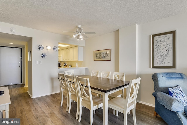 506 Brandywine House Rd Unit 506S, Bethany Beach, DE 19930 - dining area with wood finished floors, baseboards, a ceiling fan, and a textured ceiling