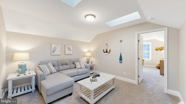 008 Antlered Way, Georgetown, DE 19947 - living area featuring a skylight, vaulted ceiling, carpet flooring, and baseboards
