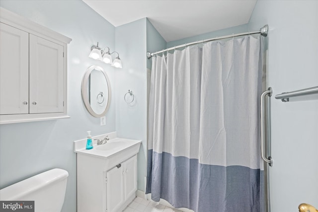 303 N W St, Alexandria, VA 22314 - bathroom with vanity, toilet, and a shower with shower curtain