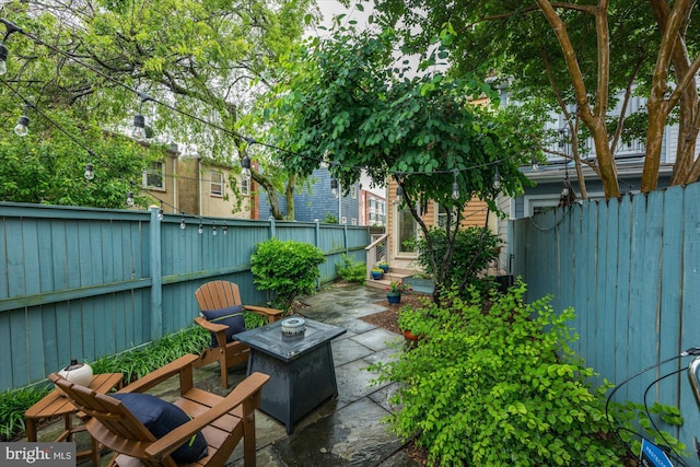 303 N W St, Alexandria, VA 22314 - fenced backyard with a patio area