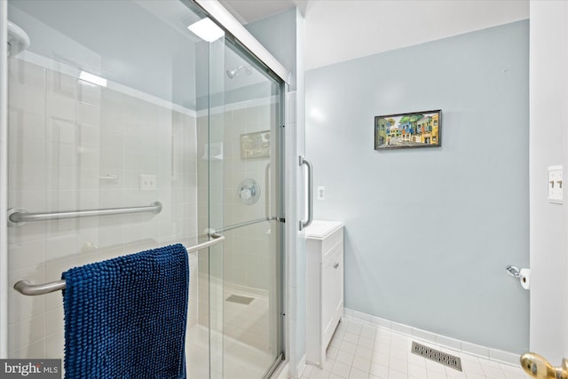 303 N W St, Alexandria, VA 22314 - bathroom featuring a stall shower, tile patterned flooring, and vanity