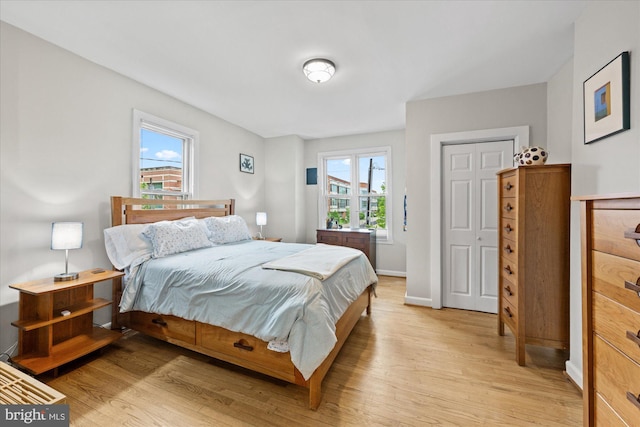 303 N W St, Alexandria, VA 22314 - bedroom featuring light wood-style flooring and baseboards