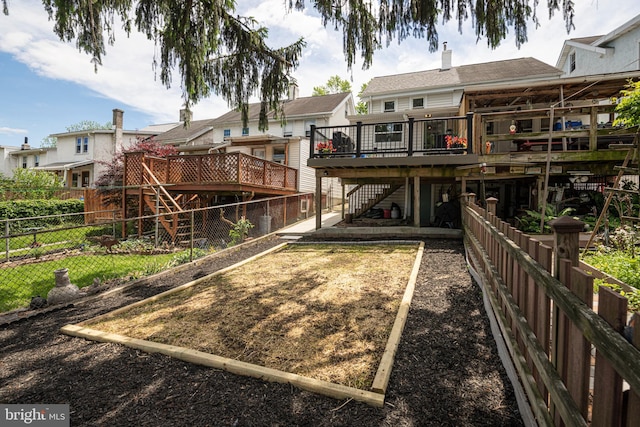 7 High St, Phoenixville, PA 19460 - back of house featuring stairs, a deck, and a fenced backyard