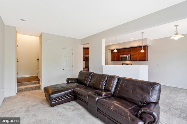 45812 Winding Branch Ter, Sterling, VA 20166 - living area with stairway, baseboards, and light colored carpet