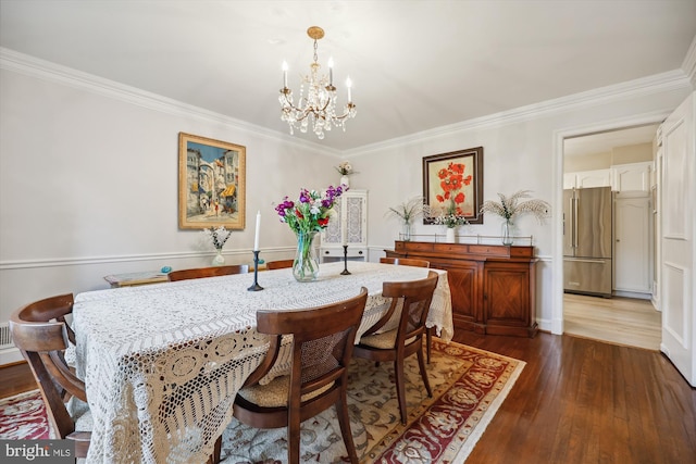 7600 Charleston Dr, Bethesda, MD 20817 - dining space featuring a chandelier, dark wood-type flooring, and crown molding