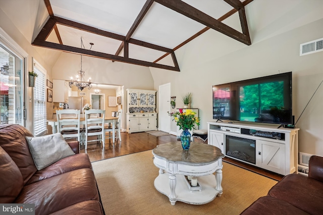 7600 Charleston Dr, Bethesda, MD 20817 - living area with beamed ceiling, a chandelier, wood finished floors, and high vaulted ceiling