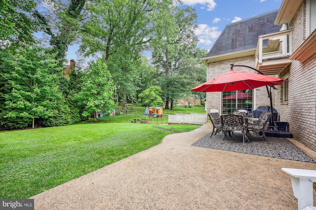 7600 Charleston Dr, Bethesda, MD 20817 - view of grassy yard featuring a patio area and outdoor dining space