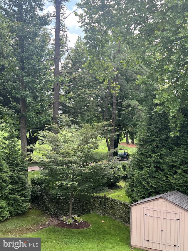 7600 Charleston Dr, Bethesda, MD 20817 - view of green lawn featuring a storage shed