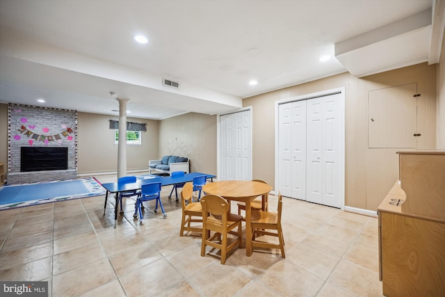 7600 Charleston Dr, Bethesda, MD 20817 - dining space featuring a fireplace, light tile patterned floors, and recessed lighting