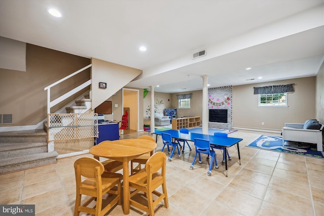 7600 Charleston Dr, Bethesda, MD 20817 - dining room featuring stairs, light tile patterned floors, recessed lighting, and a large fireplace