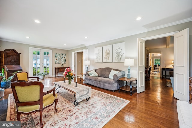 7600 Charleston Dr, Bethesda, MD 20817 - living room featuring wood finished floors, recessed lighting, crown molding, and french doors