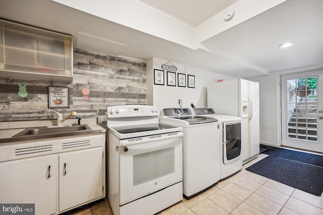 7600 Charleston Dr, Bethesda, MD 20817 - washroom with washing machine and dryer, wooden walls, and light tile patterned floors