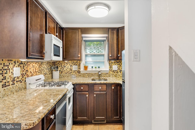 718 Addison St Unit B, Philadelphia, PA 19147 - kitchen with white appliances, tasteful backsplash, and light stone countertops