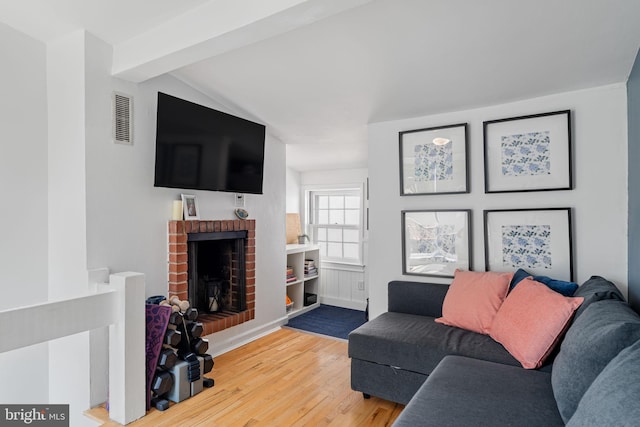 718 Addison St Unit B, Philadelphia, PA 19147 - living room with wood finished floors and a brick fireplace