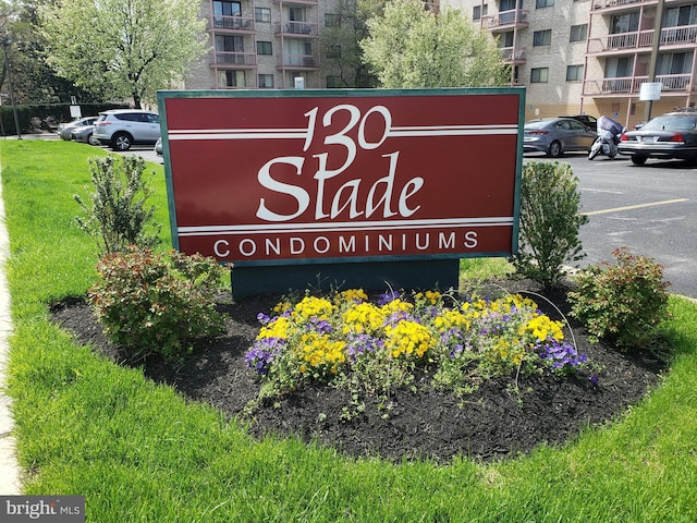 130 Slade Unit 511, Pikesville, MD 21208 - community / neighborhood sign with uncovered parking and a yard