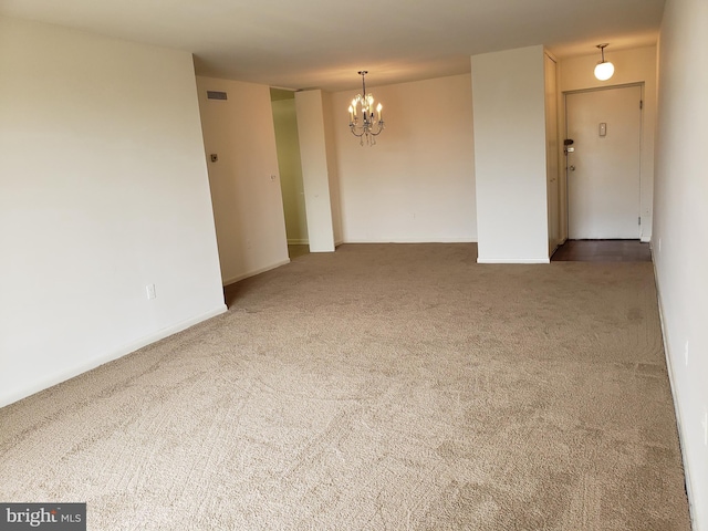 130 Slade Unit 511, Pikesville, MD 21208 - carpeted empty room featuring a chandelier