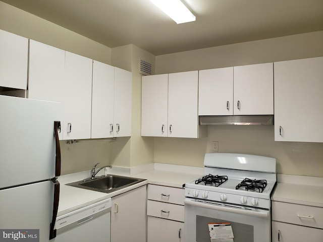 130 Slade Unit 511, Pikesville, MD 21208 - kitchen featuring white appliances, under cabinet range hood, a sink, light countertops, and white cabinets