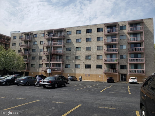 130 Slade Unit 511, Pikesville, MD 21208 - view of apartment building / complex featuring uncovered parking