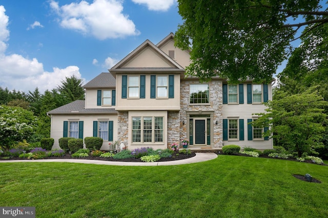 1350 Hyde Park Dr, Lancaster, PA 17601 - view of front of home featuring stone siding, a front yard, stucco siding, and roof with shingles