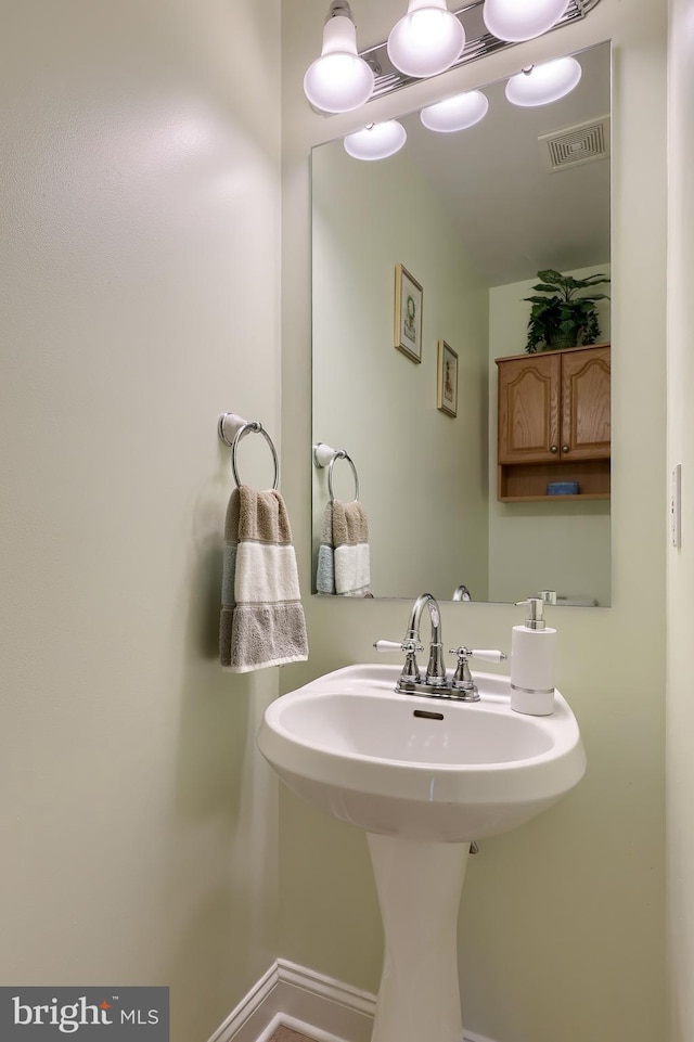 1350 Hyde Park Dr, Lancaster, PA 17601 - bathroom featuring a sink and baseboards